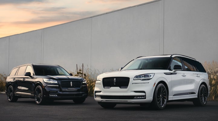 Two Lincoln Aviator® SUVs are shown with the available Jet Appearance Package | Sheehy Lincoln of Gaithersburg in Gaithersburg MD
